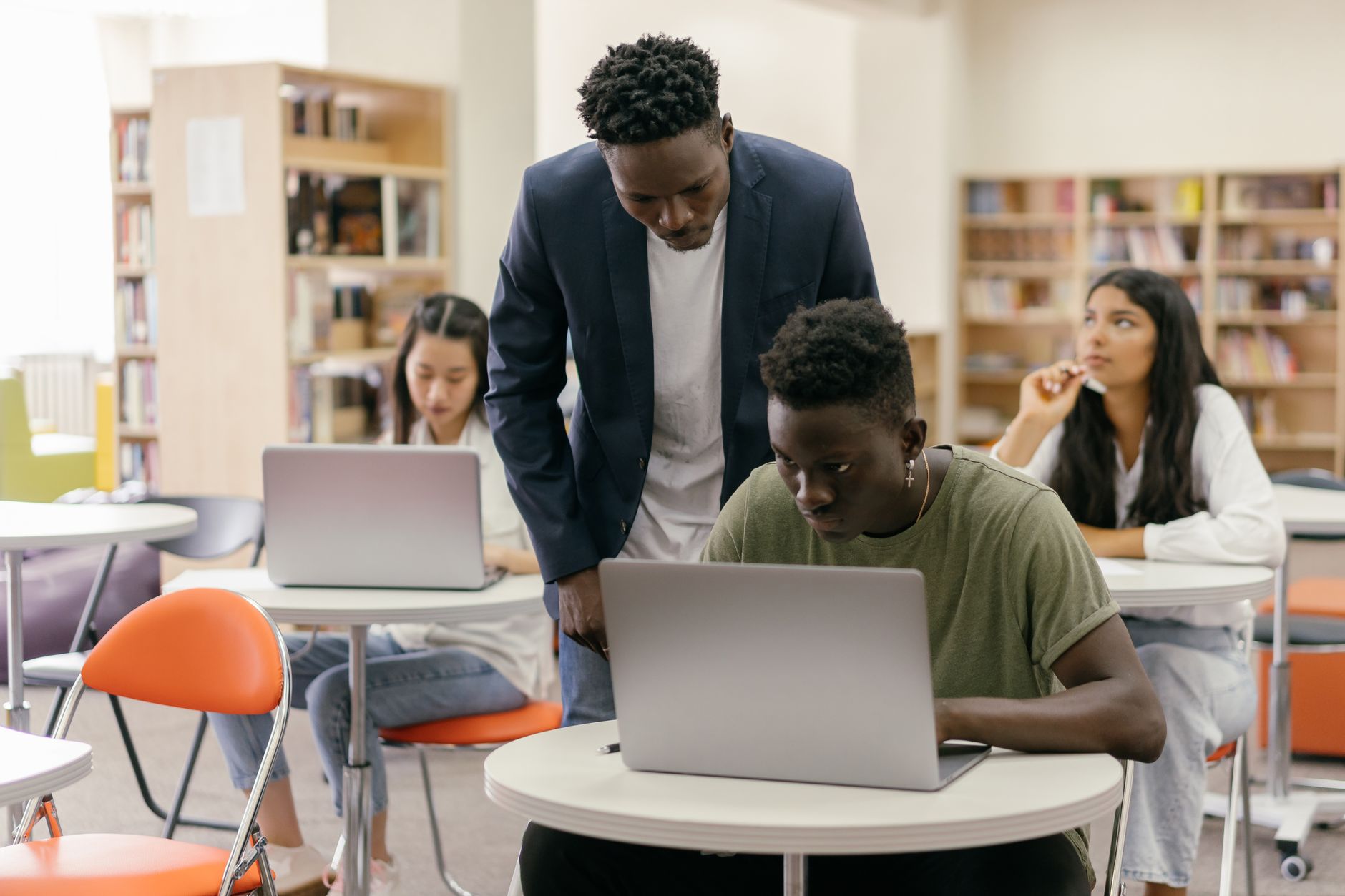 Students working on laptops in a classroom
