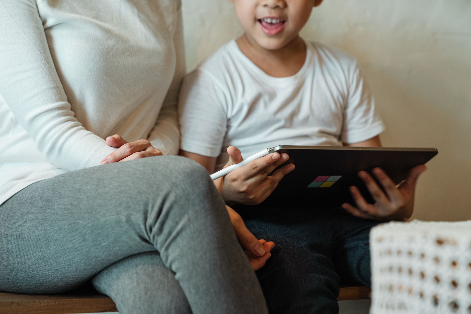 Parent and child looking at a smartphone